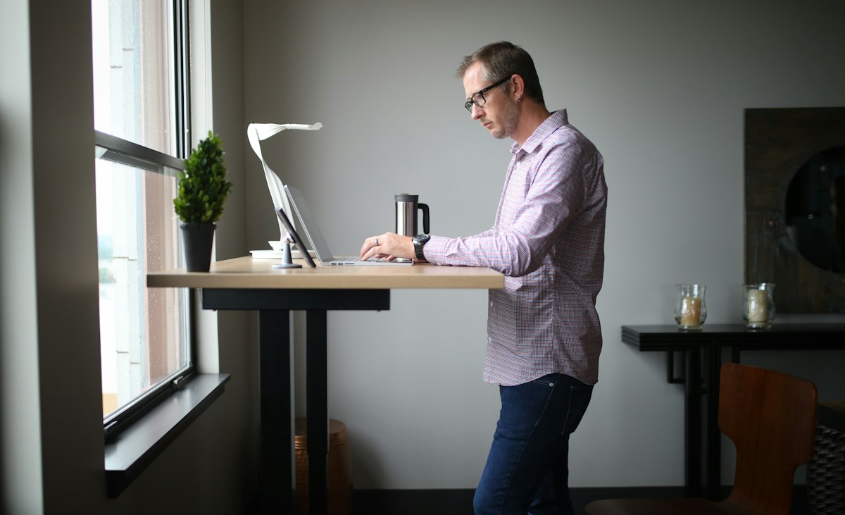 Wellness-focused office with greenery, ergonomic accessories, and mood lighting